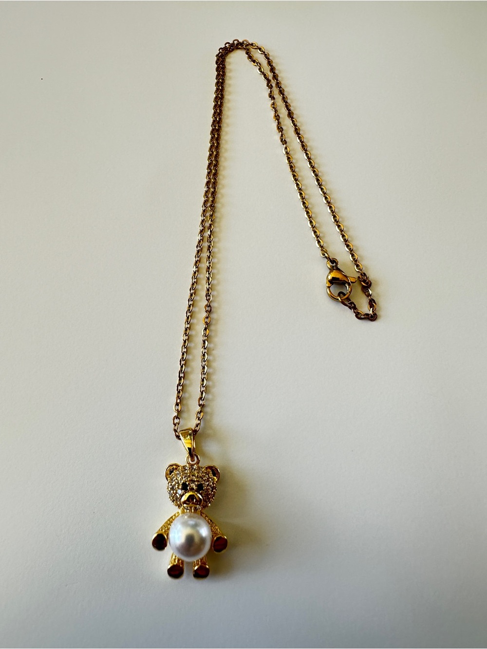 Gold Teddy Bear Pendant Necklace with White Pearl Accent